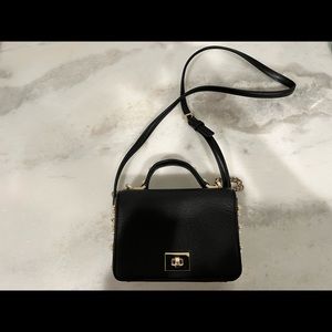 Black Kate spade clutch with shoulder strap and pearl accents